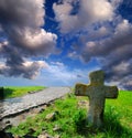 Stone cross on the neglected grave Royalty Free Stock Photo