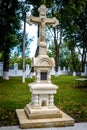 Stone cross in the old wooden church in the village Corbu. Moldova