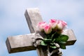 Stone Cross with Pink Roses Royalty Free Stock Photo