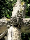 Stone cross sculpture with flowers Royalty Free Stock Photo