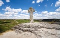 Stone cross under blue sky Royalty Free Stock Photo