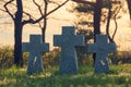 Stone crosses at sunset in German military cemetery, Europe