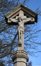 A stone crucifix statue