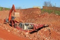 Stone crusher and digger Royalty Free Stock Photo