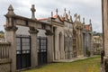 Stone crypts and columbarium with cross in european cemetery. Memory and death concept. Peace and sorrow concept.