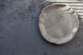 Stone curl gray platter on conrete table