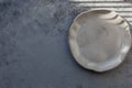Stone curl gray platter on conrete table