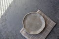 Stone curl gray platter on conrete table