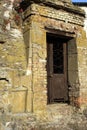 Stone curve Ruines wall with decorate iron door Royalty Free Stock Photo