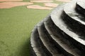 Stone and curve staircase on artificial turf and brown stone Royalty Free Stock Photo