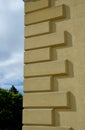 stone cylindrical bollard on the corner of the house implemented