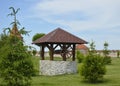 stone decorative well with a wooden roof in the city park