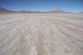 Stone deserted plain with car traces Royalty Free Stock Photo