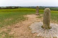 Stone of Destiny at the Hill of Tara In Ireland with a green area in the background