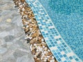 Stone on the edge of the swimming pool Royalty Free Stock Photo