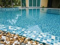 Stone on the edge of the swimming pool Royalty Free Stock Photo