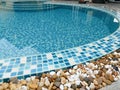 Stone on the edge of the swimming pool Royalty Free Stock Photo