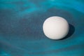 Stone egg on blue ceramic tray Royalty Free Stock Photo