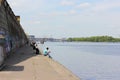 Stone embankment and fishermen