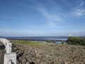 Stone embankment water recedes mangrove and the blue sky