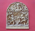 Stone emblem relief from ancient house facade