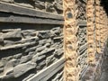 Stone embossed fence in a linear perspective