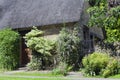 Stone english house with flower, shrub, tree garden Royalty Free Stock Photo