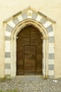 Stone entrance door at santa Maria alla Croce abbey, Tiglieto, I Royalty Free Stock Photo