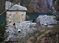 The stone facade of an ancient and beautiful house, stone roofs in the village of Isola Santa on the shore of the homonymous lake,