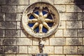 Stone facade of old catholic church with round window, Dubrovnik, Croatia Royalty Free Stock Photo