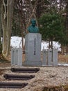 a stone face in a park