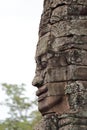 Stone face at ruins of Bayon Temple, Cambodia Royalty Free Stock Photo