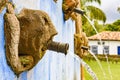 Stone face in source of drinking water built in 1749, 18th century Royalty Free Stock Photo