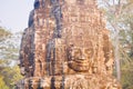 Stone face statue in ancient Bayon Temple Angkor Thom, Cambodia. Royalty Free Stock Photo