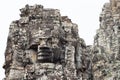 Stone face tower of ancient buddhist temple Bayon in Angkor Wat complex, Cambodia. Ancient architecture Royalty Free Stock Photo