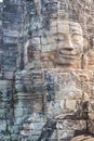 Stone faces in Angkor Thom temple, selective focus. Buddhism meditation concept, world famous travel destination, Cambodia tourism