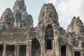 Stone faces on facade at Bayon Temple in Angkor Tom, Siem Reap, Cambodia Royalty Free Stock Photo