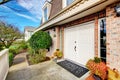 Stone facing fabulous house. Entrance white wooden doors