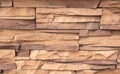 Stone facing of facades and walls.The wall is made of decorative facing stone, such as Sandstone or slate. The texture of the Royalty Free Stock Photo