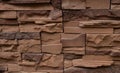 Stone facing of facades and walls.The wall is made of decorative facing stone, such as Sandstone or slate. The texture of the Royalty Free Stock Photo