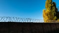 stone fence with barbed wire Royalty Free Stock Photo