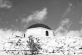 Stone fence and red dome with cross detail in Mykonos, Greece. Church building architecture on sunny outdoor. Chapel on Royalty Free Stock Photo