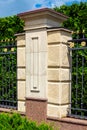 Stone fence with rustication and iron forged inserts. Royalty Free Stock Photo