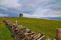 Stone fenced path to Moher Tower along the Cliffs of Moher Royalty Free Stock Photo