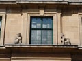 Stone figures on art-deco window