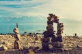 Stone figures on beach shore of Geneva lake in Switzerland