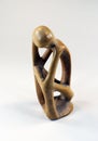 Stone figurine of a sitting and thinking man, isolated on white, creative thinker Royalty Free Stock Photo