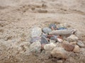 a stone fire pit with leftover kindling wood, on the beach Royalty Free Stock Photo