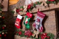 Stone fireplace decorated with christmas stockings