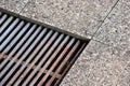 Stone floor with detail on shaft with iron and rust bars outside